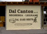 Telo in PCV con scritta pubblicitaria verniciata per chiusura vano capannone segheria. Anno 2009