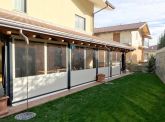Tende avvolgibili per chiusure laterali in PVC e Cristal trasparente. Anno 2016